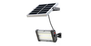 Solar-powered outdoor light fixture with solar panel on a white background