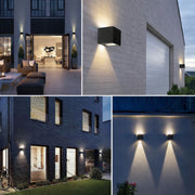 A four-image collage showing modern cube-shaped solar up-and-down wall lights installed on different outdoor settings—courtyard, exterior wall, villa facade, and boundary wall—casting warm, symmetrical light beams that highlight contemporary architecture at night