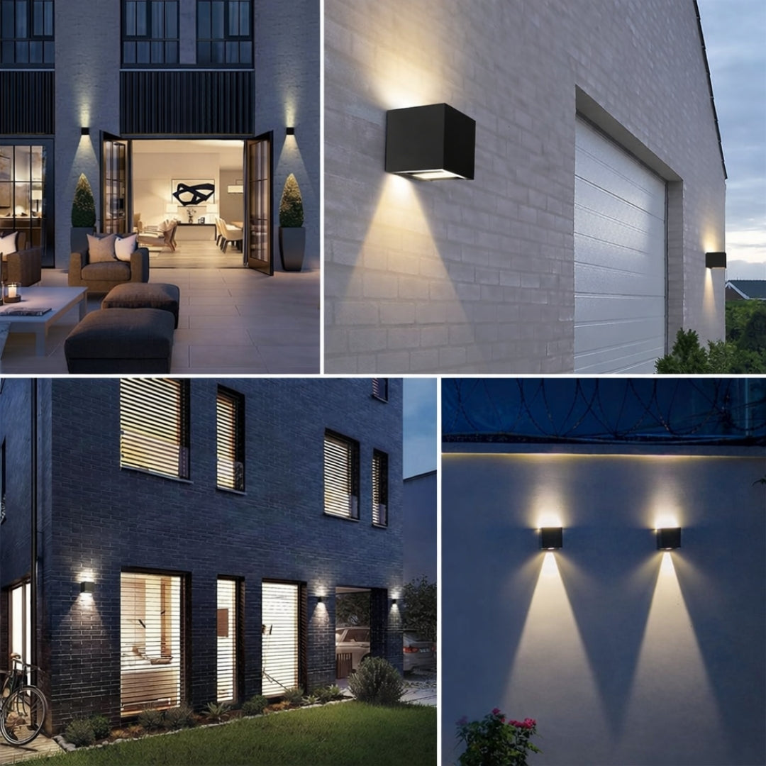 A four-image collage showing modern cube-shaped solar up-and-down wall lights installed on different outdoor settings—courtyard, exterior wall, villa facade, and boundary wall—casting warm, symmetrical light beams that highlight contemporary architecture at night