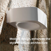 Modern outdoor solar wall light on a textured wall