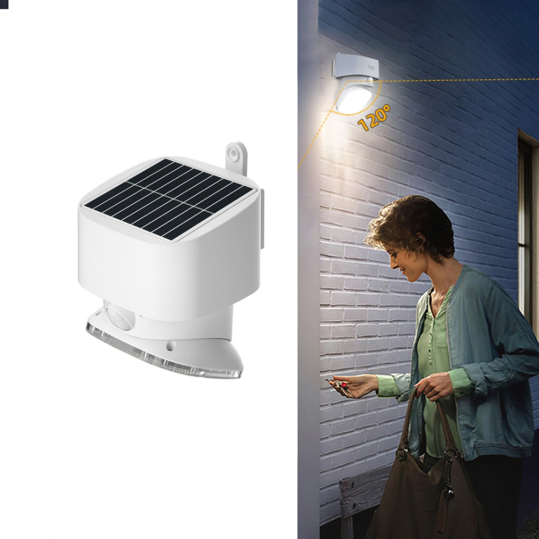 Solar-powered outdoor sensor light fixture with a woman using a smartphone in front of a building.